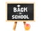 Back to school word on blackboard with apple at white background