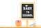 Back to school word on blackboard on wood table with apple,chalk at white background,Education concept