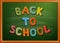 Back to school written on blackboard