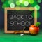 Back to school, written on blackboard with chalk