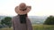 Back view of adorable young girl with hat.