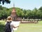 Back view of Asian woman backpacker looking at the map at old te