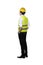 Back view of asian worker wearing safety vest and yellow helmet