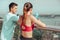 Back view of athletes standing on the bridge after exercising at looking at the city