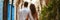 Back view of beautiful young couple admiring scenery while visiting Moroccan town on sunny summer day. Banner with young man and