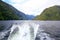 Back view of a boat, beautiful landscape. Milford Sound, New Zealand