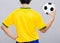 Back view of Brazil football player hold up soccer ball