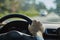 Back view closeup of a man driving a modern car