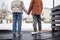 Back view of couple holding hands in ice skating rink in winter date