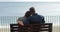 Back view of couple looking at ocean