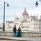 Back view couple tourists is enjoying view magnificent architecture Budapest