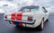 Back view of a Ford Mustang 1965 on display at a classic car meeting in Rotterdam, Netherlands