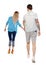 Back view of going couple. walking friendly girl and guy holding hands