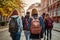 Back view of a group of students with backpacks walking along the street, Back view of a group of students with backpacks walking