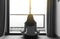 Back view of hand woman practices yoga and meditation on the lotus posture in bedroom after raining