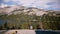 Back view happy excited tourist girl with backpack enjoying amazing mountain lake panorama at Yosemite park slow motion.