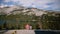 Back view happy relaxed romantic couple sit by each other enjoying amazing mountains at Yosemite park lake slow motion.