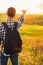 Back view, Human hand, tourist covering sunlight, Sun shining through hand, Human hand and sun, travel concept