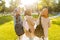 Back view image of happy friends muslim sisters women walking outdoor