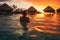 Back view of a lady swim in sea water at sunset. Summer tropical vacation concept.