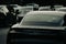 Back view of a luxury Porsche car covered in raindrops