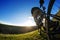 Back view of a man with a bicycle against the blue sky. cyclist rides a bicycle.