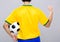 Back view of man hold soccer ball and fist up