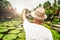 Back view of a man in summer hat using cell phone to take selfie in beautiful place. Traveler. Tourism. Wanderlust