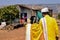 Back view newly married Indian couple walking together toward their home