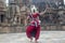Back view of an odissi dancer posing at Mukteshvara Temple, Bhubaneswar, Odisha, India