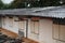 Back view of old houses, shophouses, shabby windows and roofs. Image for background.