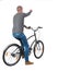 Back view of pointing man with a bicycle. cyclist sits on the bike.