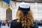 Back view of policewoman wearing uniform during the military demonstration or parade - Detail with uniformed woman standing  for