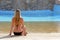 Back view portrait of a single woman watching on a water pool