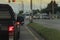 Back view of rear side black pick up car on the road.