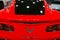 Back view of a red Chevrolet Corvette Z06. Car exterior details.