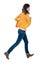 Back view of running woman in yellow cardigan