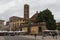Back view of San Giovanni Church and Sunday market on Piazza San Martino. Lucca. Italy.