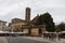 Back view of San Giovanni Church and Sunday market on Piazza San Martino. Lucca. Italy.