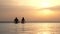 Back view, silhouettes, couple in love, man and woman, relaxing in water, on edge of outdoor infinity pool with