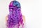 Back view of stylish youth girl with bright hair coloring, Ombre with blue purple shades.