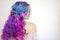 Back view of stylish youth girl with bright hair coloring, Ombre with blue purple shades.