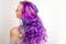 Back view of stylish youth girl with bright hair coloring, Ombre with blue purple shades.