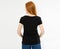 Back view t-shirt design, happy people concept - smiling red hair woman in blank black t-shirt pointing her fingers at herself,