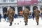 Back view of three anonymous men in military uniform