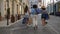 Back view of three diverse shopper females walking