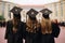 back view of three girls in graduation gowns standing on the stairs, backside graduation hats during commencement success, AI