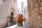 Back view of tourist girl exploring the historic town of Barletta, Apulia, Italy. Wide angle