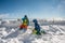 Back view of two kids playing with snow on the top of the mountain. Winter vacation with children in Alps. Glacier 3000, les