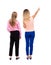 Back view of two pointing young girl. Rear view people collection.